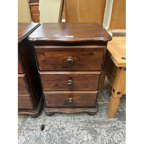 70 - A pair of pine bedside chests of drawers - approx. 67cm high x 46cm wide x 42cm deep