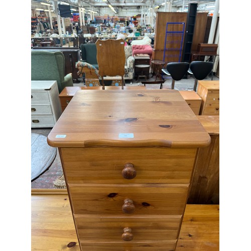 92 - A pine chest of drawers - approx. 141cm high x 43cm wide x 39cm deep