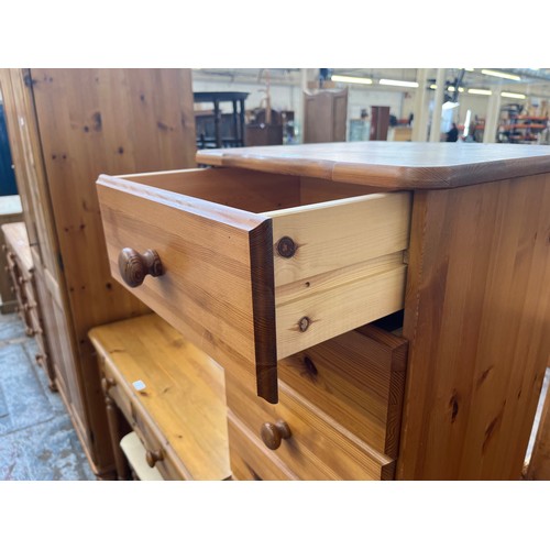 92 - A pine chest of drawers - approx. 141cm high x 43cm wide x 39cm deep