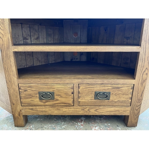 10 - A Listers Heritage solid oak TV stand - approx. 81cm high x 126cm wide x 65cm deep