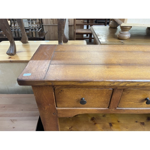 106 - A French Exigence oak two tier bookcase with three drawers - approx. 92cm high x 99cm wide x 31cm de... 