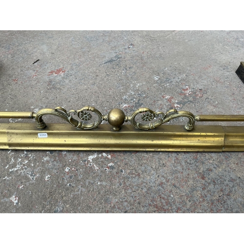 107 - A late 19th/early 20th century brass fire fender - approx. 120cm wide