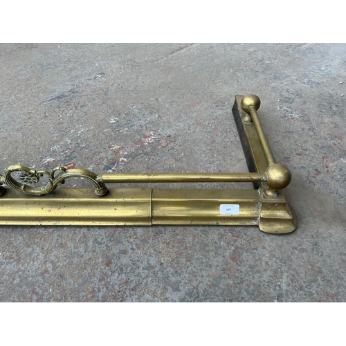 107 - A late 19th/early 20th century brass fire fender - approx. 120cm wide