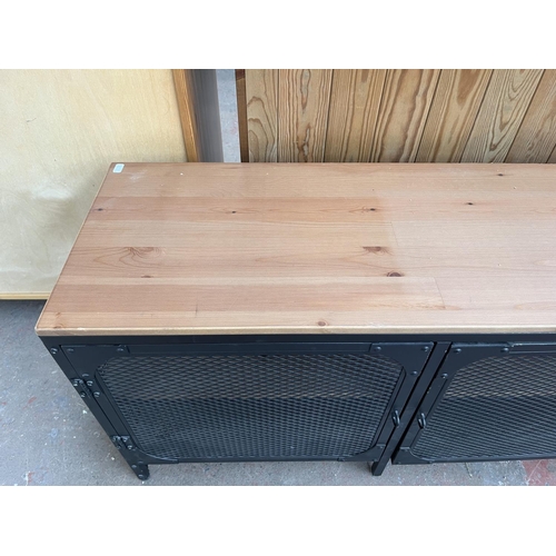 108 - An IKEA FJÄLLBO pine and black metal TV bench - approx. 55cm high x 149cm wide x 36cm deep