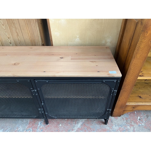 108 - An IKEA FJÄLLBO pine and black metal TV bench - approx. 55cm high x 149cm wide x 36cm deep