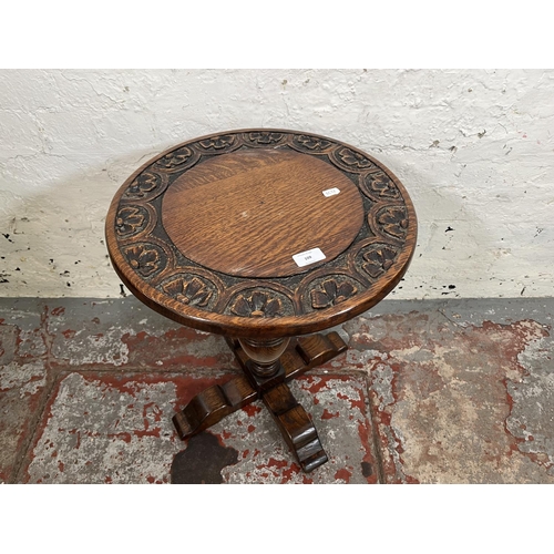 109 - A 17th century style carved oak circular pedestal side table - approx. 53cm high x 43cm diameter