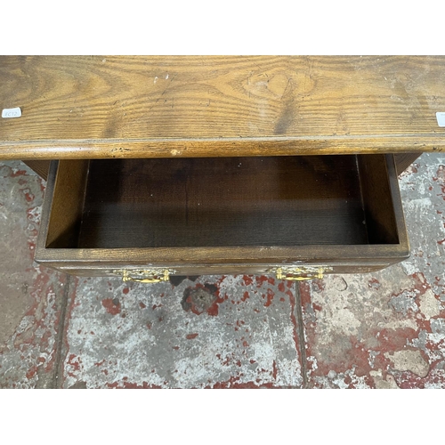 110 - A Georgian style oak two tier side table with single drawer - approx. 75cm high x 65cm wide x 38cm d... 