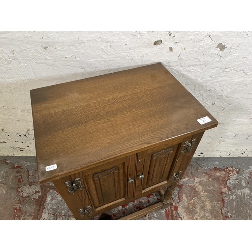 112 - An Old Charm oak linenfold two door side cabinet - approx. 71cm high x 50cm wide x 35cm deep