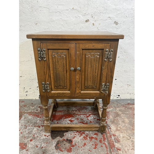 112 - An Old Charm oak linenfold two door side cabinet - approx. 71cm high x 50cm wide x 35cm deep