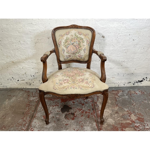 116 - A French Louis XV style carved walnut and tapestry upholstered armchair