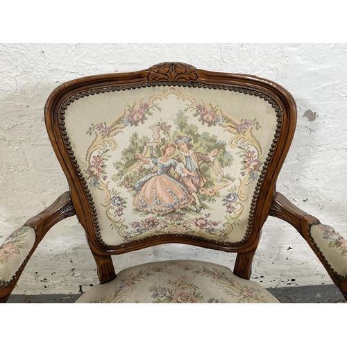 116 - A French Louis XV style carved walnut and tapestry upholstered armchair