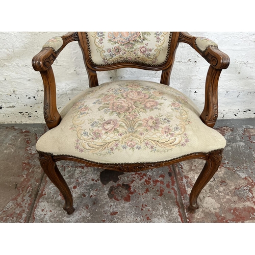 116 - A French Louis XV style carved walnut and tapestry upholstered armchair