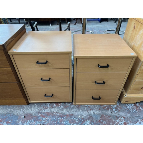 119 - Three pieces of furniture, two beech effect bedside chests of drawers and one pine effect chest of d... 