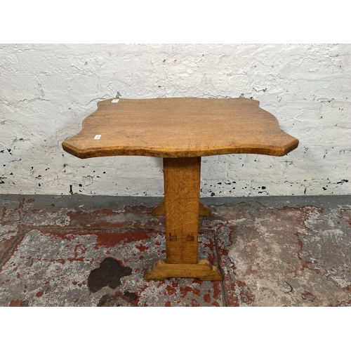 120 - A mid 20th century oak serpentine tilt top side table - approx. 77cm high when tilted x 43cm wide x ... 