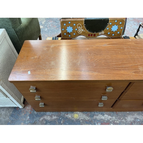 121 - A Stag teak chest of drawers - approx. 64cm high x 148cm wide x 43cm deep