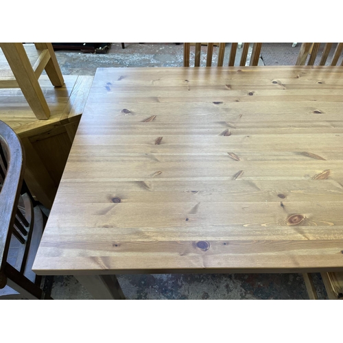 15 - A pine rectangular dining table and four chairs - approx. 75cm high x 100cm wide x 180cm long