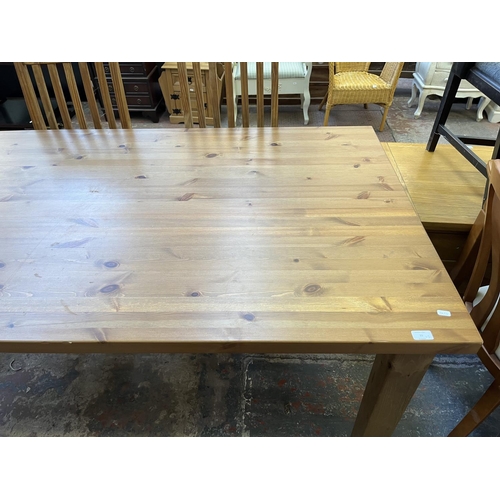 15 - A pine rectangular dining table and four chairs - approx. 75cm high x 100cm wide x 180cm long