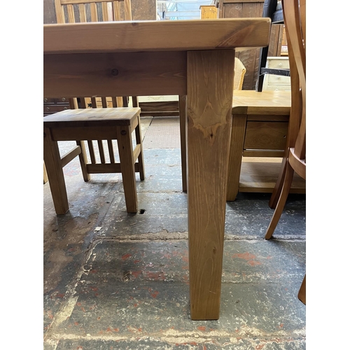 15 - A pine rectangular dining table and four chairs - approx. 75cm high x 100cm wide x 180cm long