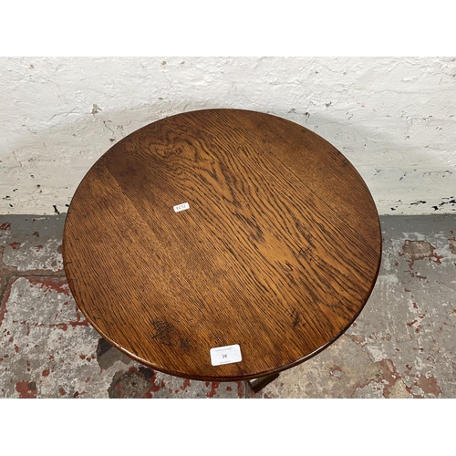 16 - A 17th century style oak circular pedestal side table - approx. 56cm high x 50cm wide