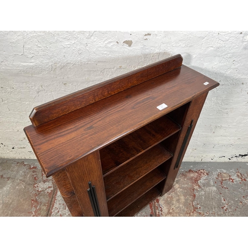 21 - An Art Deco Atcraft oak four tier bookcase - approx. 98cm high x 76cm wide x 21cm deep