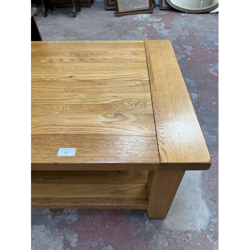 22 - A Besp-Oak solid oak rectangular two tier coffee table - approx. 46cm high x 61cm wide x 91cm long