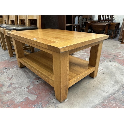 22 - A Besp-Oak solid oak rectangular two tier coffee table - approx. 46cm high x 61cm wide x 91cm long