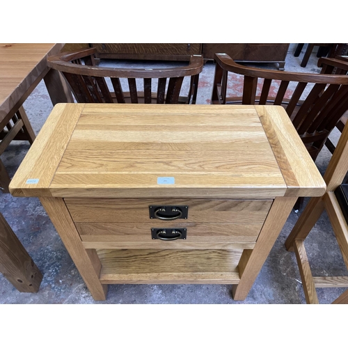 24 - A modern solid oak single drawer side table - approx. 75cm high x 70cm wide x 35cm deep