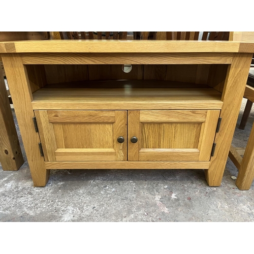 25 - A Besp-Oak solid oak TV stand - approx. 63cm high x 93cm wide x 50cm deep