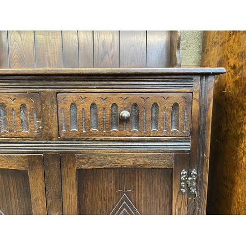 3 - A carved oak dresser - approx. 174cm high x 91cm wide x 33cm deep