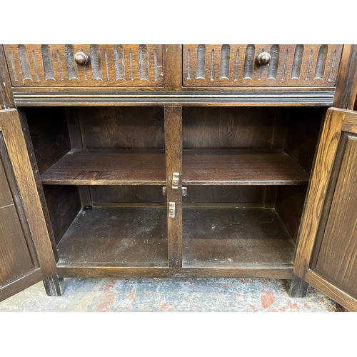 3 - A carved oak dresser - approx. 174cm high x 91cm wide x 33cm deep