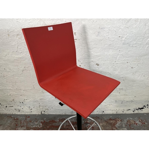 46 - A Vitra .04 red plastic and metal counter chair designed by Maarten Van Severen - approx. 122cm high... 