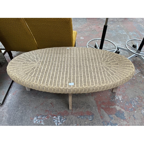 47 - A wicker and mindy ash oval coffee table - approx. 47cm high x 60cm wide x 120cm long