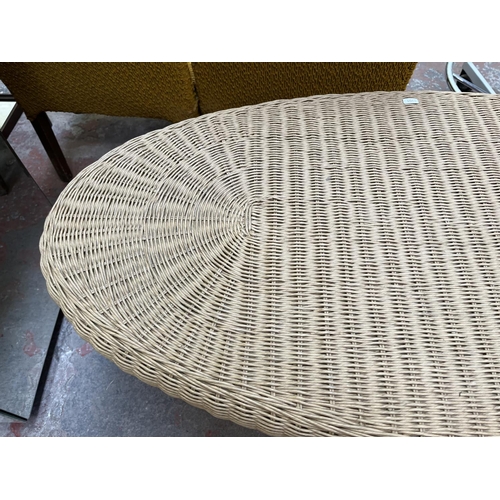 47 - A wicker and mindy ash oval coffee table - approx. 47cm high x 60cm wide x 120cm long