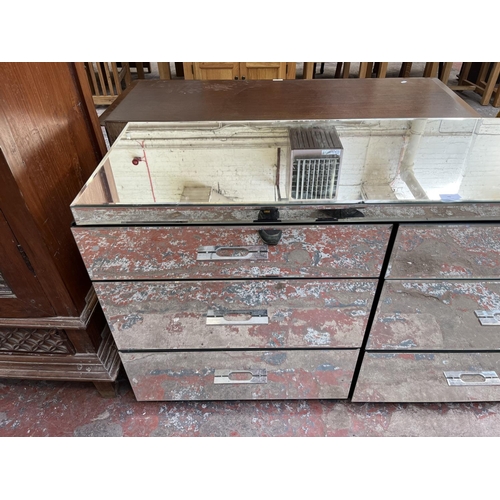 48 - A mirrored glass chest of drawers