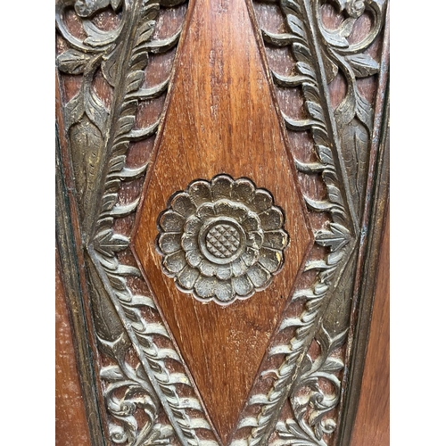 49 - An Indonesian carved teak two door cabinet - approx. 166cm high x 114cm wide x 49cm deep