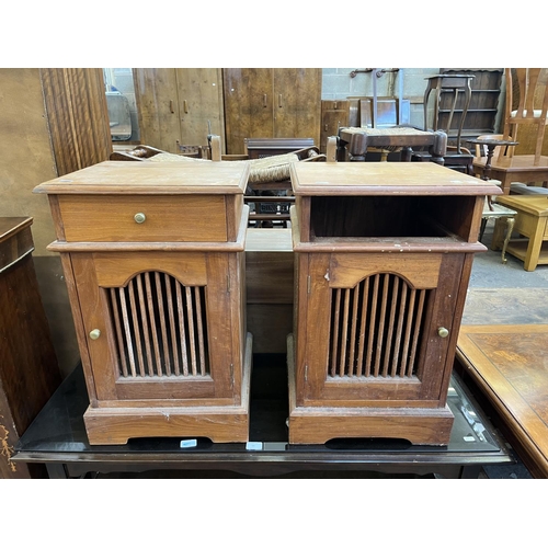 54 - A pair of Asian teak bedside cabinets