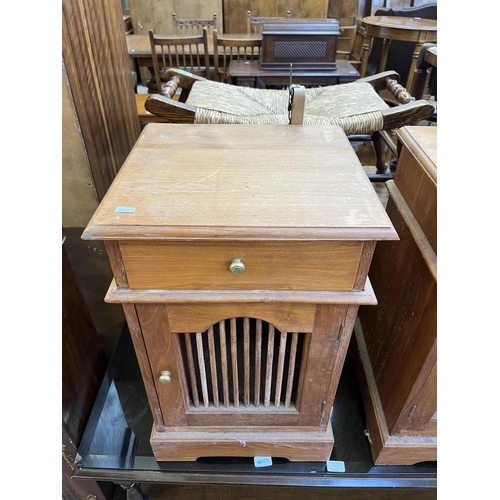 54 - A pair of Asian teak bedside cabinets