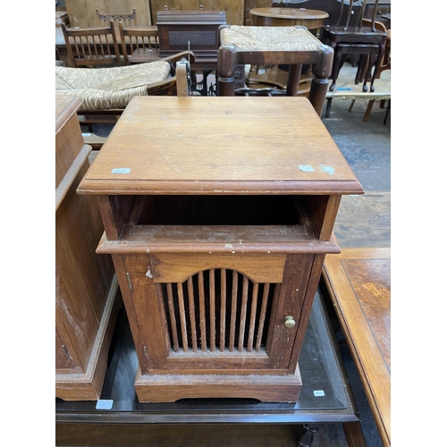 54 - A pair of Asian teak bedside cabinets