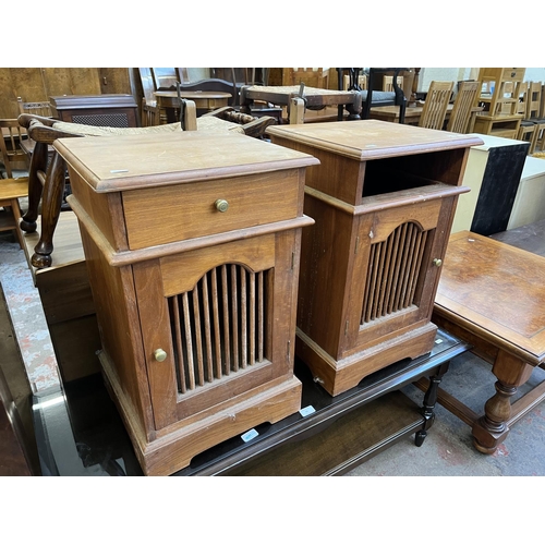 54 - A pair of Asian teak bedside cabinets