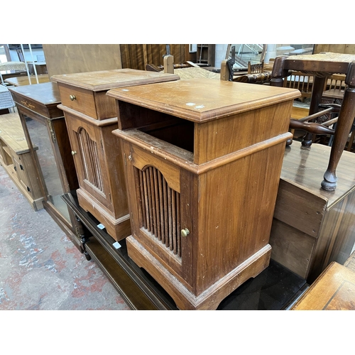 54 - A pair of Asian teak bedside cabinets