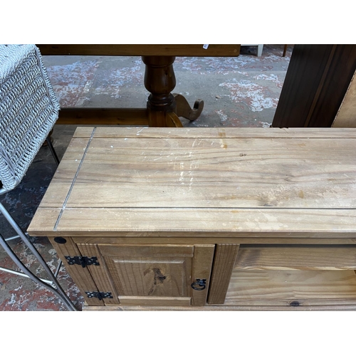 57 - A Mexican pine TV stand - approx. 51cm high x 130cm wide x 35cm deep