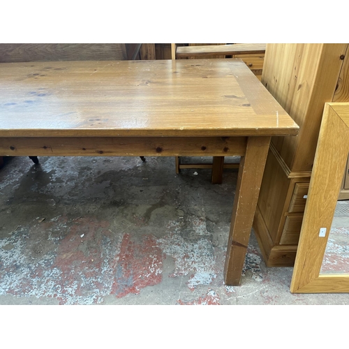 67 - A pine rectangular dining table - approx. 76cm high x 92cm wide x 183cm long