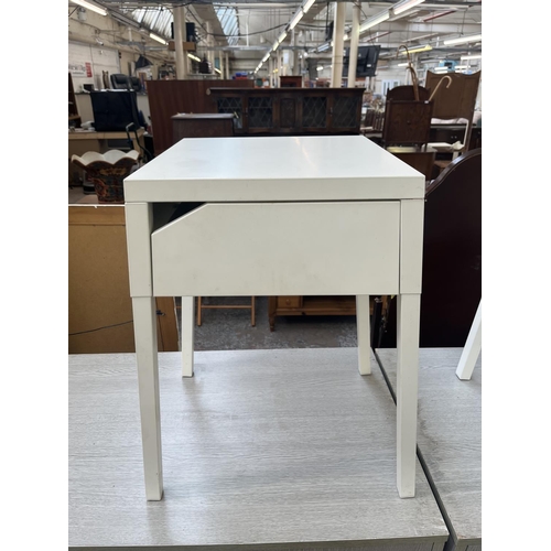 73 - A pair of IKEA white metal bedside tables - approx. 56cm high x 36cm wide x 37cm deep