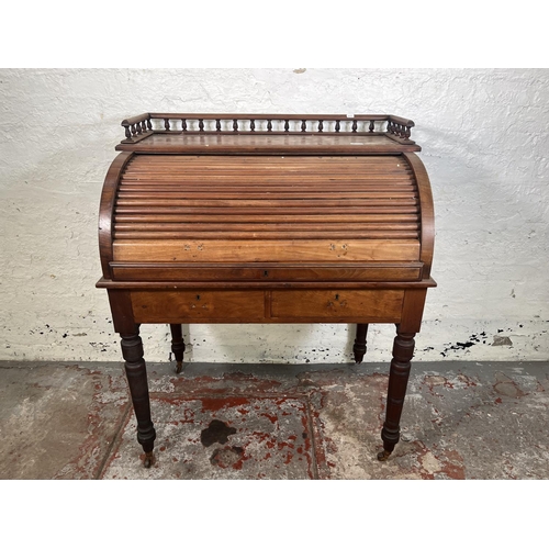 78A - A Victorian mahogany roll top writing desk with two drawers, galleried top and turned supports - app... 