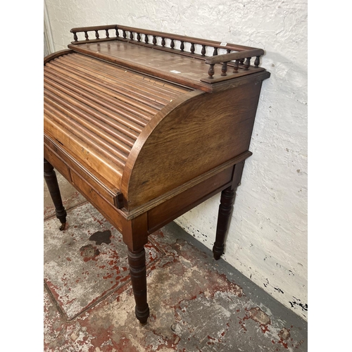 78A - A Victorian mahogany roll top writing desk with two drawers, galleried top and turned supports - app... 