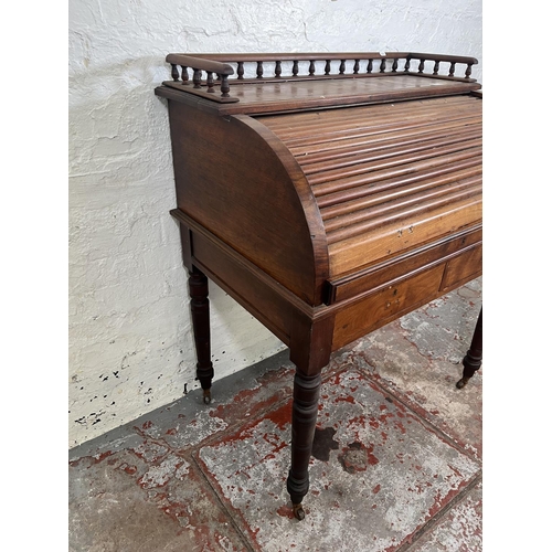 78A - A Victorian mahogany roll top writing desk with two drawers, galleried top and turned supports - app... 