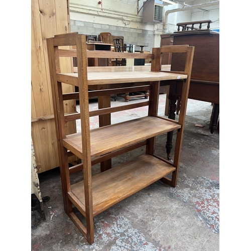 79 - A mid 20th century beech three tier folding bookshelf - approx. 94cm high x 71cm wide x 29cm deep