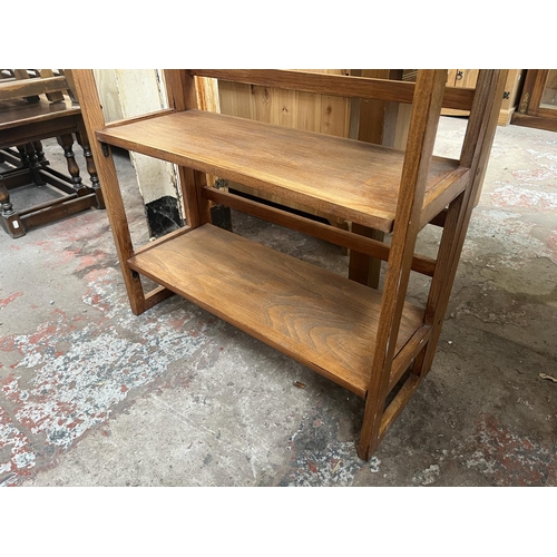 79 - A mid 20th century beech three tier folding bookshelf - approx. 94cm high x 71cm wide x 29cm deep