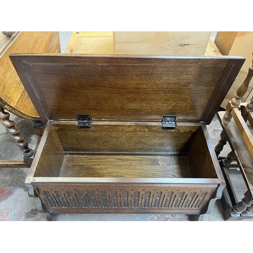 81 - A carved oak blanket box - approx. 43cm high x 80cm wide x 36cm deep