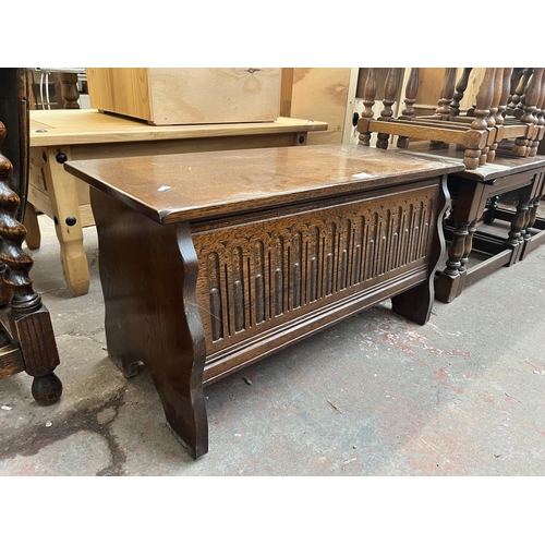 81 - A carved oak blanket box - approx. 43cm high x 80cm wide x 36cm deep